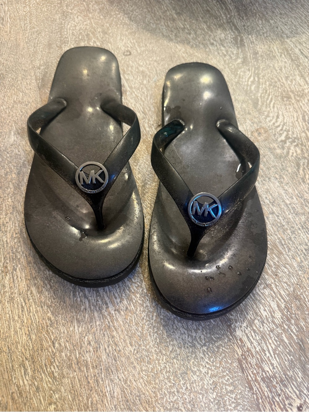 Michael Kors Black Jelly Logo Flip Flops with Silver MK Emblems